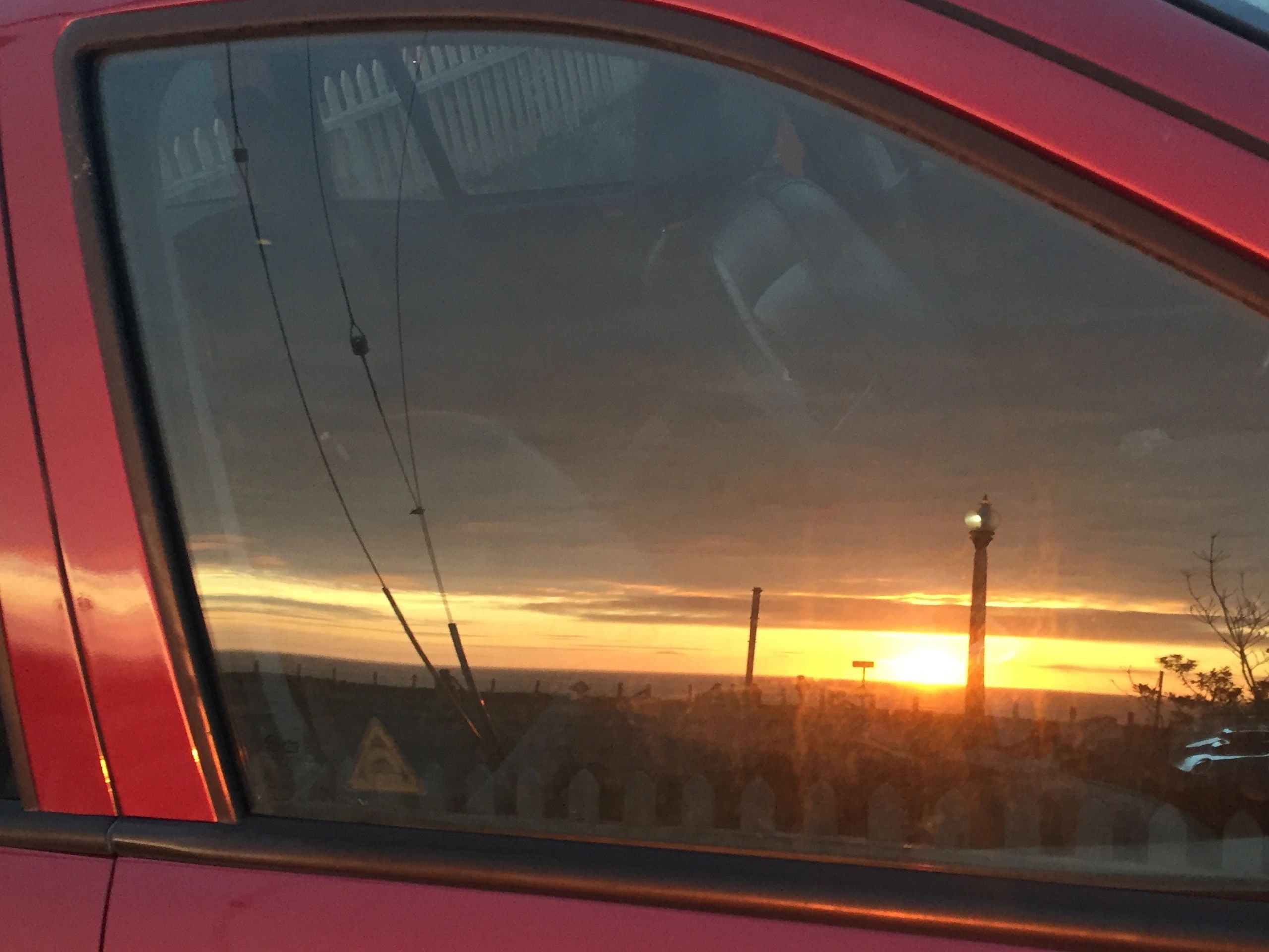 Sunset reflected in car window
